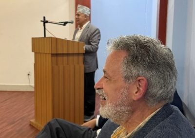 Bill Axinn listening to a speaker at the reception.